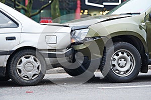 Car crash accident on street, damaged automobiles after collision in city