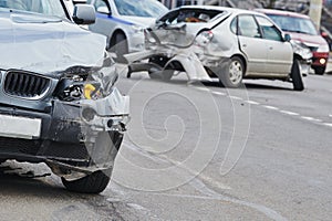 Car crash accident on street, damaged automobiles after collision in city