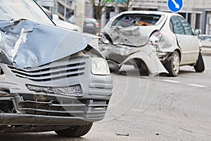 Car crash accident on street, damaged automobiles after collision in city