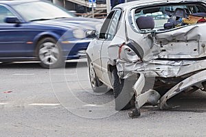 Car crash accident on street, damaged automobiles after collision in city