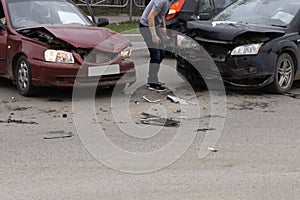 Car crash accident on street, damaged automobiles after collision in city