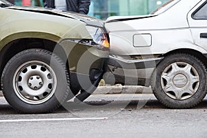 Car crash accident on street, damaged automobiles after collision in city