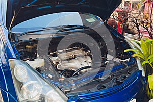 Car crash open hood car mechanic to check condition of damage. See the radiator cooling panel Engine and electronic