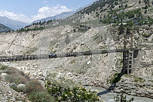 Car cross the long steel bridge one at a time at Himachal Pradesh, India.