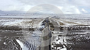 Car Crossing a Bridge on Icelandic Roads During the Winter