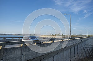 Car crossing over Barragem do Caia road, Campo Maior, Alentejo, Portugal