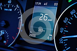 car dashboard computer display with 20000 kilometers mileage