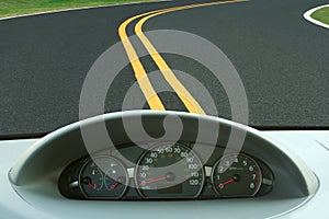 Car dashboard and curvy road photo