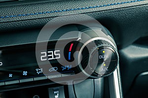 Car dashboard details with climate controls, close up