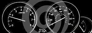 Car dashboard dials - engine RPM and speedometer