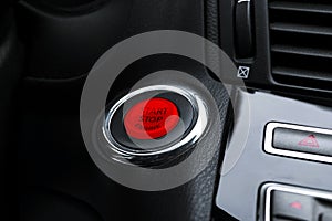 Car dashboard with focus on engine start stop button. Modern car interior details. start/stop button. Car inside