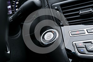 Car dashboard with focus on engine start stop button, Modern carCar dashboard with focus on engine start stop button, Modern car i