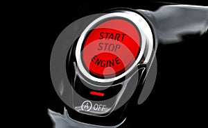 Car dashboard with focus on red engine start stop button. Modern car interior details. start/stop button. Car inside. Ignition