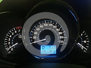 Car dashboard modern automobile control illuminated panel speed display. Modern car instrument panel dashboard with blue