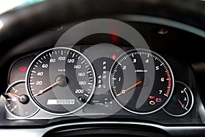 Car dashboard. Speedometer and tachometer close-up.