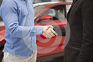 Car dealer selling new autos at the dealership