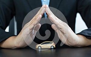 Car dealers or insurance managers cover and protect against damage and the risk of driving photo