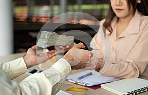 Car dealers or insurance managers gave the keys to the customers and receiving money who signed the purchase or loan