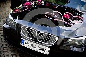 Car decked with flowers for your wedding photo