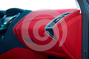 Car deflector. Car interior details. Red and black alcantara with stitching photo
