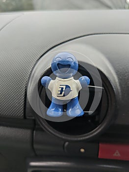 Car deodorant affixed to car air conditioner.