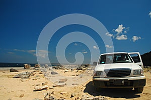 Car on desert beach Bonaire