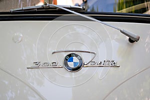 Car design detail and logo / brand name closeup of the BMW Isetta 300 at Oldtimer automobile event in Berlin