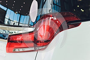 Car detail. New led taillight by night. The rear lights of the car, in hybrid sports car. Developed Car's rear brake