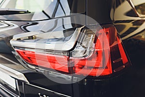 Car detail. New led taillight by night. The rear lights of the car, in hybrid sports car. Developed Car`s rear brake