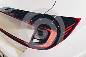 Car detail. New led taillight by night. The rear lights of the car, in hybrid sports car. Developed Car`s rear brake