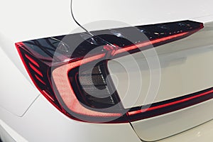 Car detail. New led taillight by night. The rear lights of the car, in hybrid sports car. Developed Car`s rear brake