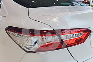 Car detail. New led taillight by night. The rear lights of the car, in hybrid sports car. Developed Car`s rear brake