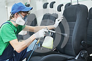 Car detailing. cloth seat upholstery cleaning with high pressure air pulse cleaning gun