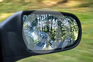 Car with distance in driving-mirror