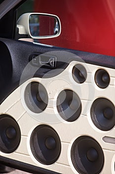 Car door full of stereo speakers