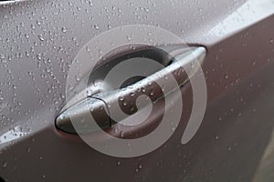 Car door handle in rain