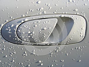 Car Door Handle and Raindrops