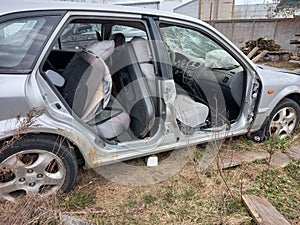 Car without doors after an accident. Fatal car crash aftermath