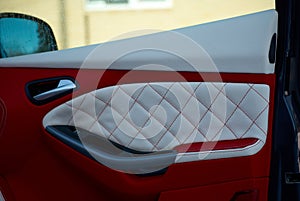 Car Doors. Car interior details. White red leather with stitching