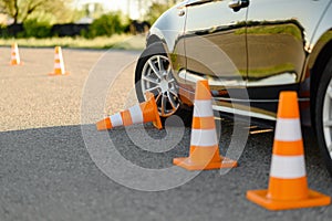 Car and downed cone, driving school concept