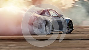 Car drifting, Blurred  image diffusion race drift car with lots of smoke from burning tires on speed track