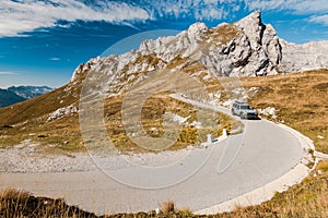 Car drive on dangerous mountain pass in Mangart