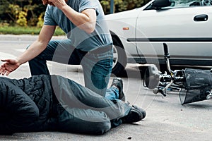 Car driver making emergency call after collision with a cyclist