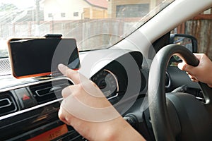 Car Driver With Smart Phone on Dashboard