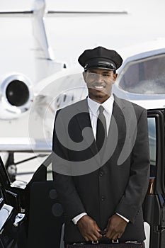 Car Driver Standing By Car At Airfield photo