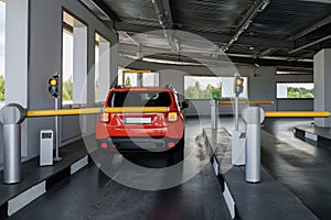 The car drives into the paid underground parking. Parking security system