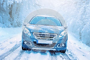 Car drives through the snow. Winter driving concept