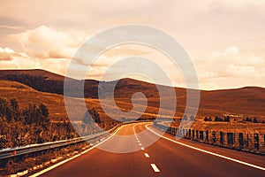 Car driving on the asphalt road, autumn