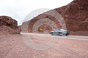 Car driving on desert road, Cafayate, Salta, Argentina