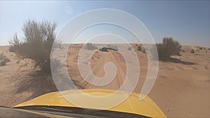 Car is driving in the desert. Windshield camera. Dubai